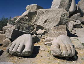 EGYPT, Nile Valley, Thebes, The Ramesseum with view of the feet from the giant statue of Ramses II