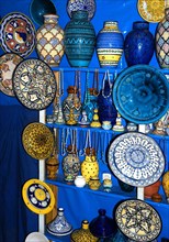 MOROCCO, Marrakech, Display of brightly coloured ceramic vases and plates