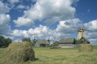 ESTONIA, Saaremaa Island, Farm buildings haystack and windmill