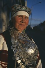 ESTONIA, Rakvere, Folk dancer in traditional costume.  Portrait.
