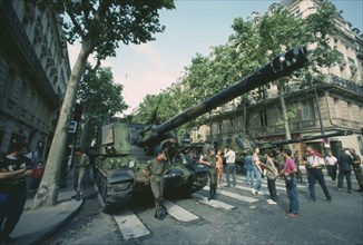 FRANCE, Ile de France, Paris, Bastille Day celebrations on July 14th.  Crowds looking at tanks in
