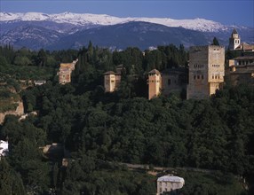 SPAIN, Andalucia, Granada, Alhambra Palace walls and towers seen from Mirador San Nicolas with the