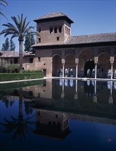 SPAIN, Andalucia, Granada, The Alhambra. Palace of the Maids general view of the tower reflected in