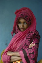 SOMALIA, People, Portrait of young woman in traditional shawl