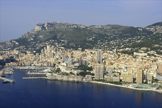 MONACO, Cote d Azur, Monte Carlo, Aerial view from the sea toward the coastal city and harbour