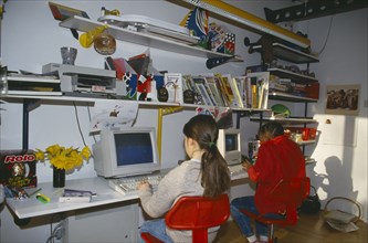 EDUCATION, Children, Computers, Young kids using computers in bedroom.