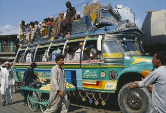 PAKISTAN, Transport, Crowded colourful bus in Khwakakhela Swat area.
