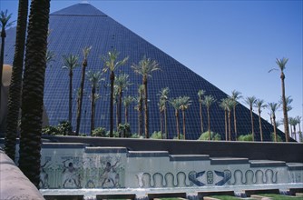 USA, Nevada, Las Vegas, The Luxor Hotel exterior with replica pyramid and hieroglyphics.  Water