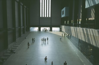 ENGLAND, London, Tate Modern. View over the Old Turbine Hall main entrance with scattering of