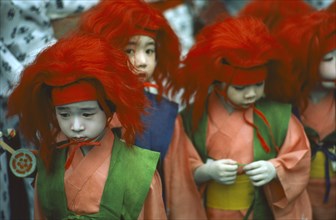 JAPAN, Honshu, Kyoto, Gion Matsuri with group of children dressed in traditional costume.
