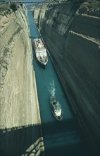 GREECE, Peloponese, Corinth Canal, Cruise ship being towed by a tug through the canal