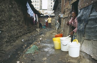 KENYA, Nairobi, Mathare Valley, Village One residents in the narrow alleys of the notorious no go