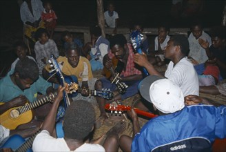 PACIFIC ISLANDS, Melanesia, Vanuatu, Tanna.  Musicians playing guitars at John Frumm service.