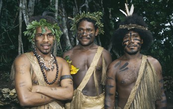 PACIFIC ISLANDS, Melanesia, Vanuatu, Port Vila.  Three men wearing traditional dress and body