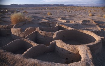 CHILE, Atacama Desert, Excavated village dwellings in desert landscape.
