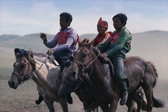 MONGOLIA, Horses, National Day horse race with boy jockeys on horseback