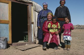 MONGOLIA, Central Gobi, Family outside their Yurt