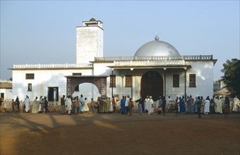 CAMEROON, Foumbam, Crowds at exterior to mosque like building at the begining of the Fete Foumbam
