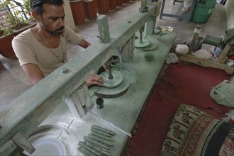 INDIA, Rajasthan, Jaipur, Man polishing precious stones