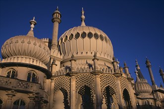 ENGLAND, East Sussex, Brighton, Brighton Pavilion exterior section showing onion domes in evening
