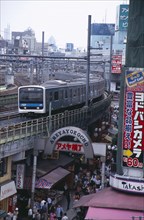 JAPAN, Honshu, Tokyo, View over the busy Ameyayokocho market street and the elevated train tracks