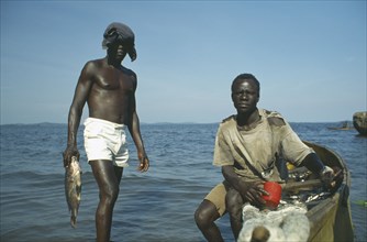 UGANDA, Kampala, Men fishing in Lake Victoria.