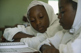 NIGERIA, Kano, Primary school children reading a book
