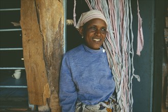 TANZANIA, Arusha, Portrait of smiling woman at Kisongo Masai market outside Arusha.