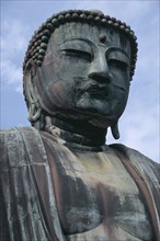JAPAN, Honshu, Kamakura, Angled view looking up at the head of the Daibutsu aka Great Buddha statue