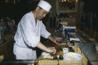 JAPAN, Honshu, Tokyo, Sushi chef in Tsukiji Market
