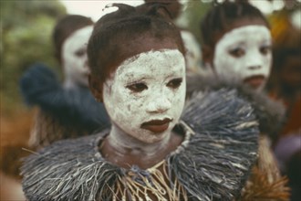SIERRA LEONE, Initiation Ceremony, Portrait of girl initiate with white painted face.