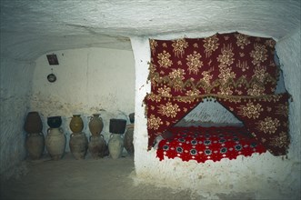 TUNISIA, Zaraoua, "Berber home, interior room cut from rock"
