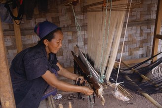 LAOS, Craft, Hmong woman weaving on hand loom