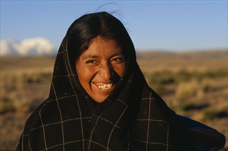 BOLIVIA, Altiplano,  La Paz, Quecha shepherdess smiling near La Paz