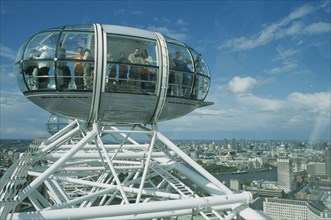ENGLAND, London, British Airways London Eye Milennium wheel capsule and skyline behind.