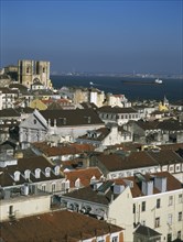 PORTUGAL, Lisbon, Bairro Alto, View over city rooftops toward The Se Cathedral and River Tagus from