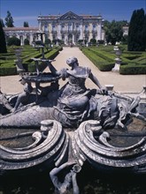 PORTUGAL, Near Lisbon, Palacio Nacional de Queluz facade with fountain statue in the foreground and