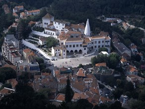 PORTUGAL, Sintra, Aerial view looking down on the town and Palacio Nacional de Sintra.