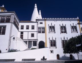 PORTUGAL, Sintra, "Palacio Nacional de Sintra facade and huge conical chimneys above, dating from