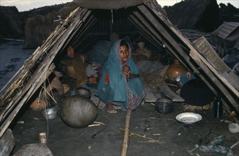 BANGLADESH, Harirampur, Flood victim and child in makeshift shelter