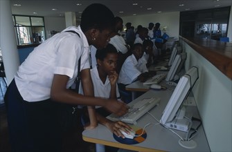 NIGERIA, Abuja, Men and women working at British Council computers