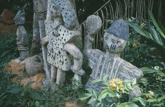 NIGERIA, Oshogbo, Oshun shrine carvings showing hunters and priests