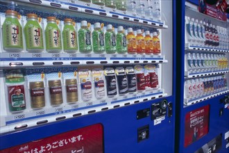 JAPAN, Honshu, Tokyo, Asakusa. View along cold drinks vending machines