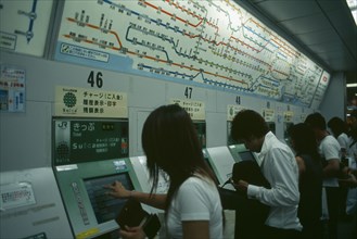 JAPAN, Honshu, Tokyo, Shinjuku. People using Metro or Subway ticket vending machines