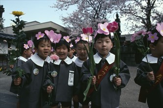 JAPAN, Honshu, Tokyo, Asakusa.  Nursery school children dressed for Hana Matsuri flower festival
