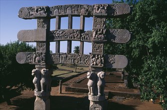 INDIA, Madhya Pradesh, Sanchi, Southern Gateway of the Great Stupa carved with scenes from the life