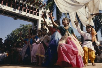 INDIA, Goa, Margao, Children dressed as adults performing dance during carnival.
