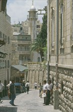 ISRAEL, Jerusalem, Old City East, Via Dolorosa narrow street lined with shops. Aka The Way of