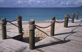 WEST INDIES, Antigua, Galley Bay, View to the beach and sea from a wooden hotel beach terrace
