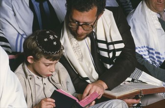 ENGLAND, Religion, Judaism, Jewish father and son attending preparation for Bar Mitzwah in